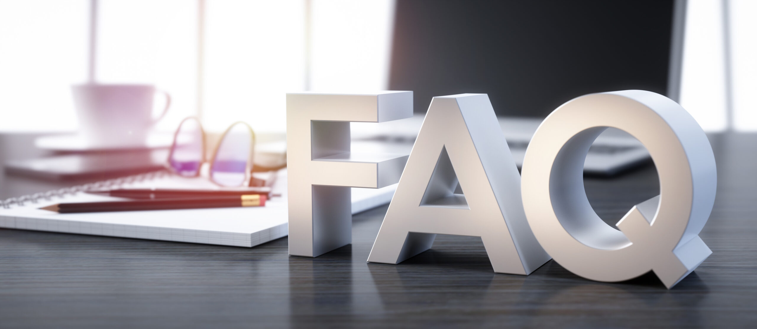 3D render of a FAQ sign on a office workplace background.
