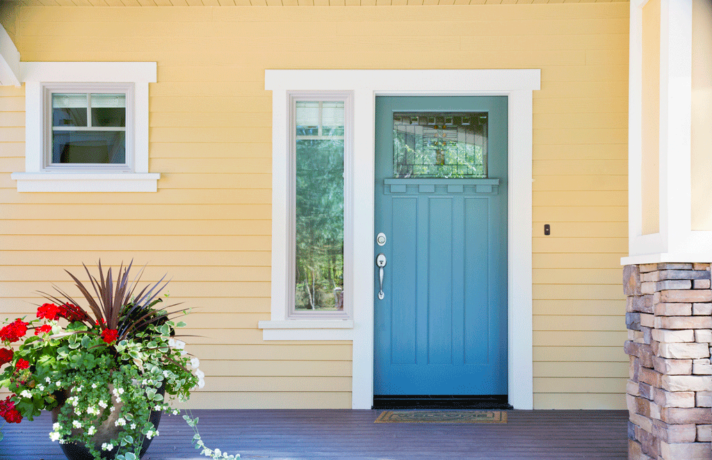 yellow house with blue entry door | entry doors and storm doors ft worth tx dallas tx 