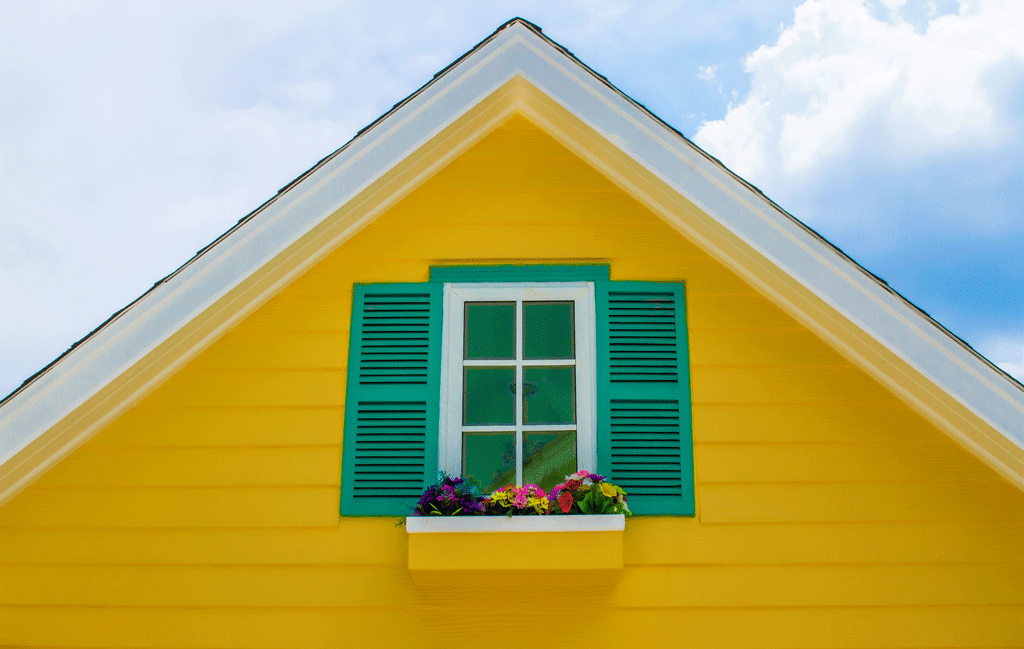 yellow house with plants and green shutters shutter company dallas tx southlake tx ft worth tx