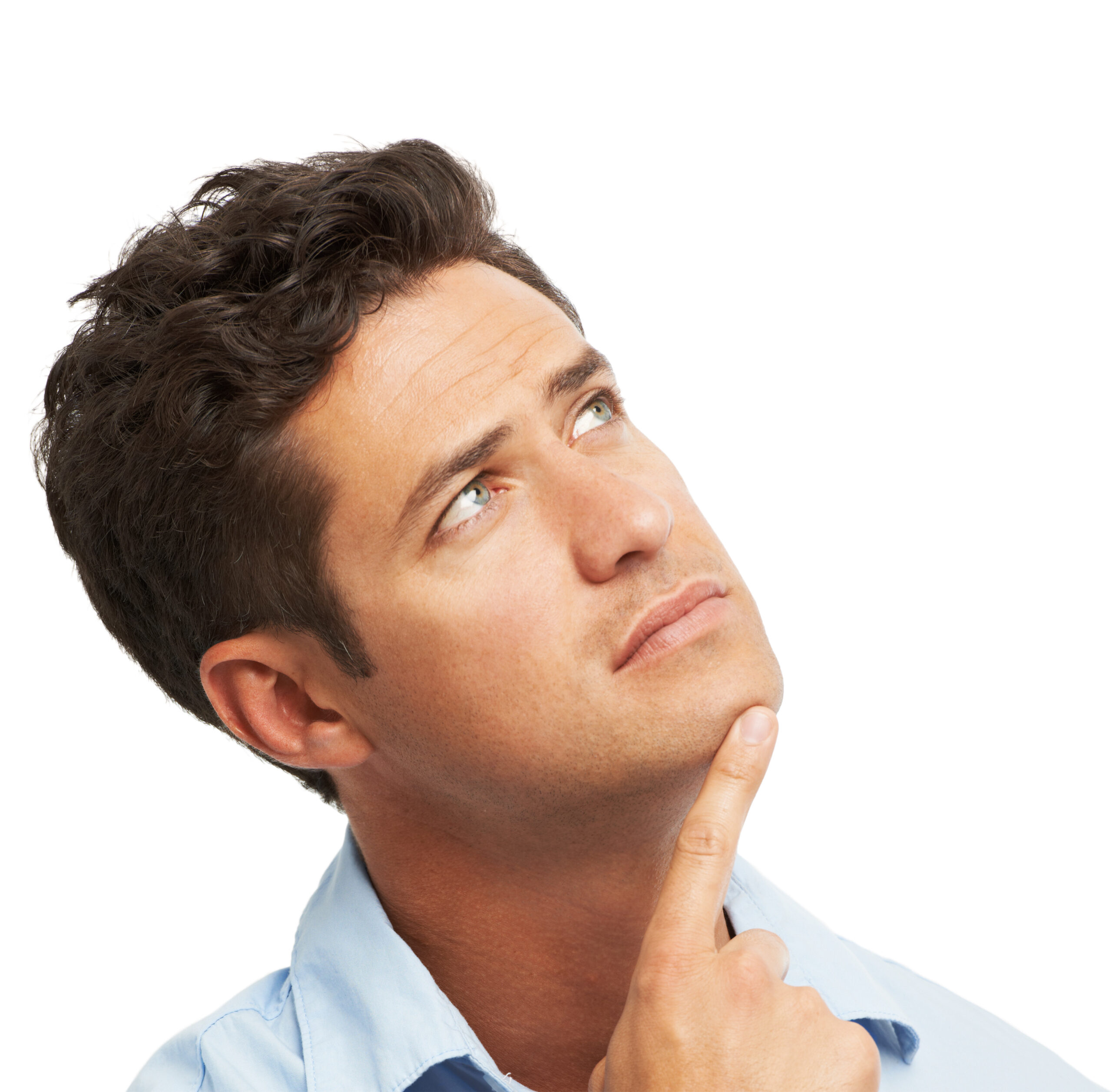 A young man looking upwards thoughtfully while isolated on white